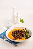Roast beef with sweet potato puree and asparagus