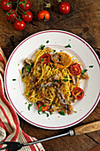 Spaghetti with breaded anchovies and roasted tomatoes