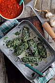 Zucchini cheese dumplings with herbs and tomato sauce