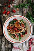 Barley salad with tomatoes and chicken breast