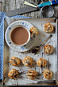 Coconut macaroons with chocolate and a cup of tea