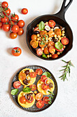 Polenta slices topped with cherry tomatoes, chickpeas and spring onions