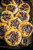 Onion pastries with poppy seeds