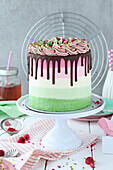 Dripping ombre cake with swirl and pistachio raspberry filling