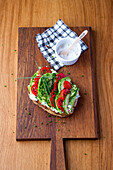 Sandwiches with curd cheese, avocado, tomatoes and chives