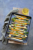 Roasted carrots and asparagus with garlic and herbs