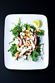 Octopus salad with shrimp on rocket salad