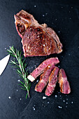 Large rib eye steak with rosemary
