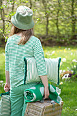 Woman in a green outfit at a picnic