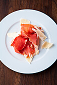 Dried ham with parmesan shavings