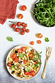 Rocket tagliatelle with cherry tomatoes, eggplant and feta cheese