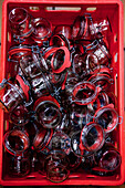 Many preserving jars in a red box