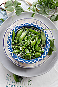 Young green peas with broad beans and cheese