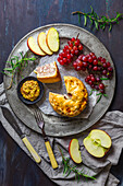 British pork pie with grainy mustard, apple slices and red grapes