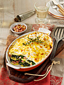 Potato gratin with spinach and bacon