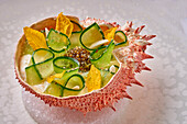 Cucumber with caviar in a spider crab shell