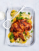 Schmetterlingshuhn mit Harissa und Orangen-Couscous