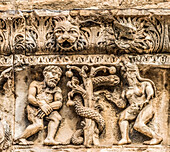 Adam and Eve facade, Nimes Cathedral, Gard, France. Created 1100 AD.