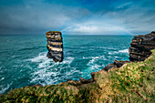 Dun Briste Sea Stack resists the onslaught of the stormy Atlantic Ocean, County Mayo, Ireland.