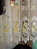 Italy, Tuscany, Province of Siena, Montalcino. Pretty lace curtains.