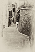 Italy, Umbria. Vintage look of a street in the historic town of Montone.