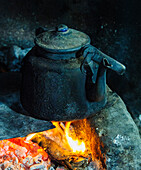 Chile, Aysen, Rio Colonia. Kettle over the fire.