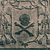 Melaka, West Malaysia. Skull and crossbones stone carving on old Portuguese tombstones in Melaka's ruined St. Paul's church.