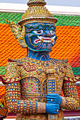 Thailand, Bangkok. Yaksha, demon depicted in the Ramayana, guarding Wat Phra Kaew (Temple of The Emerald Buddha).