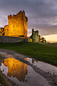 Historic Ross Castle at dusk in Killarney National Park, Ireland