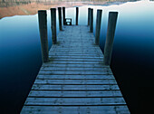 Pier On Calm Waters Of Derwent Water Shortly After Dawn
