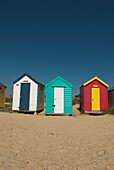 Traditional beach huts in the sand dunes at Southwold, Suffolk, UK