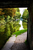 UK, Hertfordshire, and Lush Green Surrounding; Hemel Hempstead, path and barges, Grand Union Canal