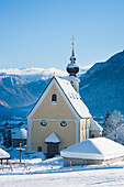 Snow Covered Alpine Scenery With Mountains, Picturesque Church, Ski And Snowboard Resort At Waidring, Austrian Alps, Austria