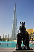 United Arab Emirates, View of horse statue with Burj Khalifa hotel in background; Dubai