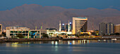 United Arab Emirates, View of city skyline at dusk; Ras Al Khaimah