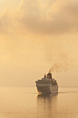 Greece, Cruise ship at dawn; Corfu