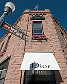 USA, Colorado, Downtown shopping district; Aspen, Dior store on corner of Galena St and Hopkins Ave