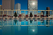 USA, Colorado, Downtown Denver skyline viewed from roof top pool of Warwick Hotel; Denver