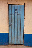 Door of room in cheap hotel; Kenya