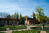 People Sunbathing On A Spring Day In Holland Park, West London, London, Uk