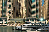UAE, Dubai, Boats and residential flats; Dubai Marina