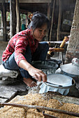 Woman making spring roll pastry Battambang Cambodia
