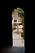 Looking Through Ornate Doorway To Courtyard Of Riad Dar Hanane; Marrakesh, Morocco