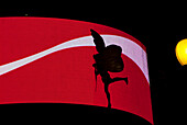 Uk London, Piccadilly Circus, Eros Silhouetted Against Red Electronic Billboard