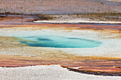 Colorful mineral deposits in geothermal features, in a geyser basin at Yellowstone National Park.; Yellowstone National Park, Wyoming