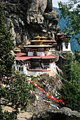 Taktsang Lhakhang, known as The Tiger's Nest, is a monastery clinging to a vertical granite cliff.; Paro, Bhutan
