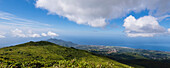 Cloud formation and mountain landscape with Basse-Terre town as seen from slopes of volcano La Soufriere, an active stratovolcano on Basse-Terre Island; Guadeloupe, French West Indies