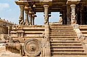 Horse drawn chariot carved in stone outside Dravidian Chola era Airavatesvara Temple with stairs leading to the interior; Darasuram, Tamil Nadu, India