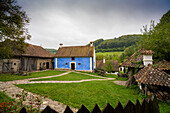 HRH Prince Charles's Guest House painted in the traditional royal blue, in the village of Zalanpatak in Transylvania; Zalanpatak, Transylvania, Romania
