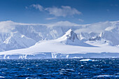 Icebergs and mountains near Cuverville Island, Antarctica.